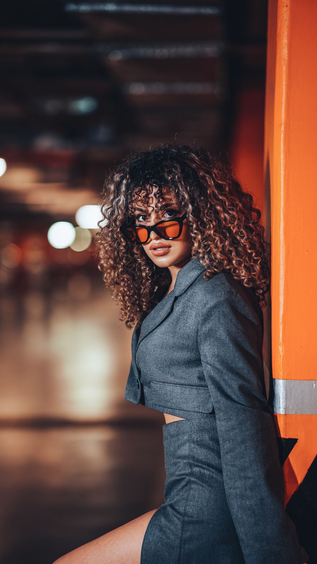 A short structured jacket worn with a matching skirt
