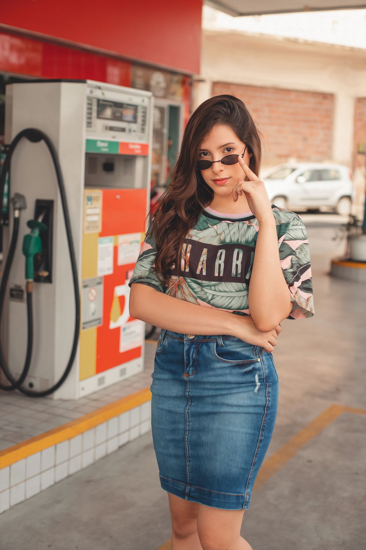 A fitted denim skirt worn with a patterned top