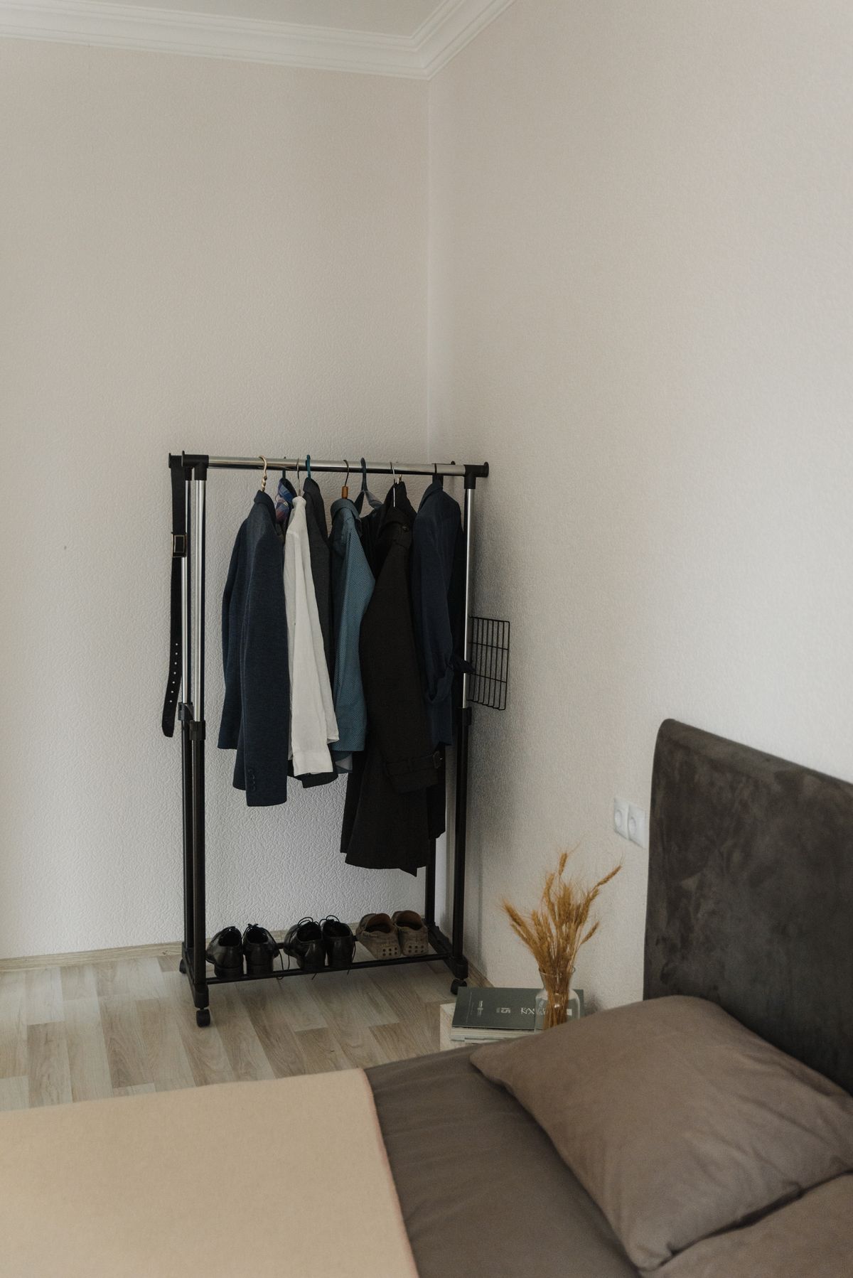 An open clothes rail kept to a small selection